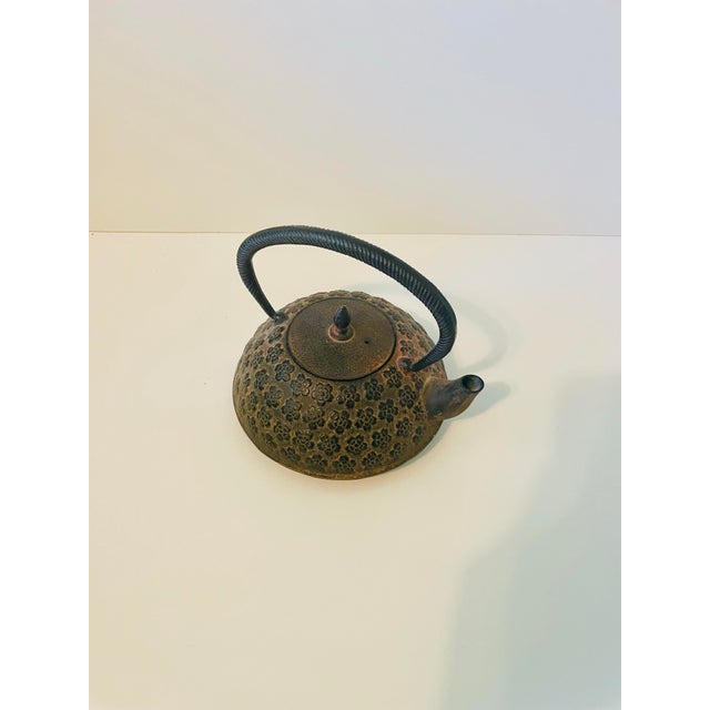 Bring a touch of timeless Japanese craftsmanship into your home with this vintage Nanbu Tekki (cast ironware) Tetsubin...