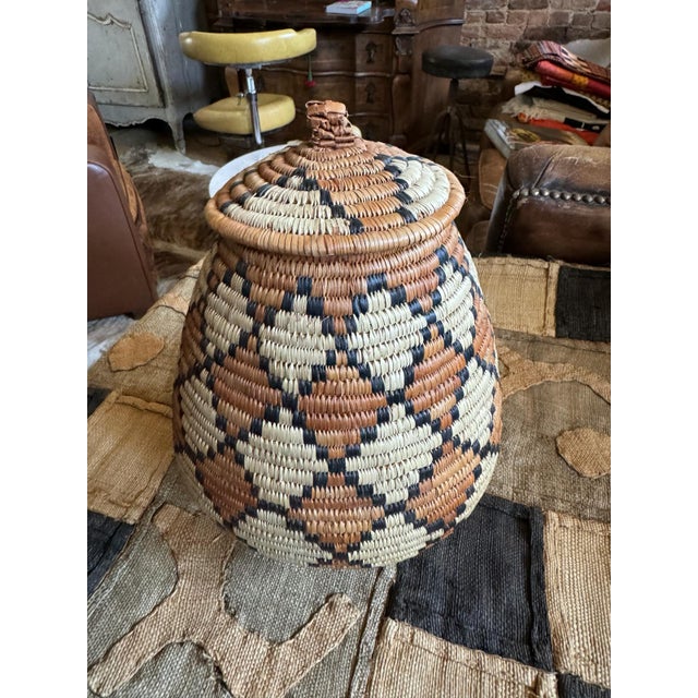 African Zulu Ukhamba Beer Basket – Handwoven Tribal Vessel The Zulus are the largest tribe in Southern Africa, renowned...