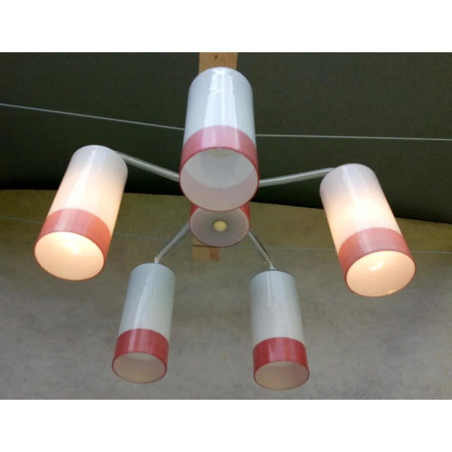 Nice retro vintage chandelier from the times of socialism. It has a nickel-plated holder. Tubes made of technical clear...