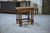 Rustic nesting tables in oak, 1950s. Each table rests on charming twisted legs—a motif inherited from the neo-Louis XIII...