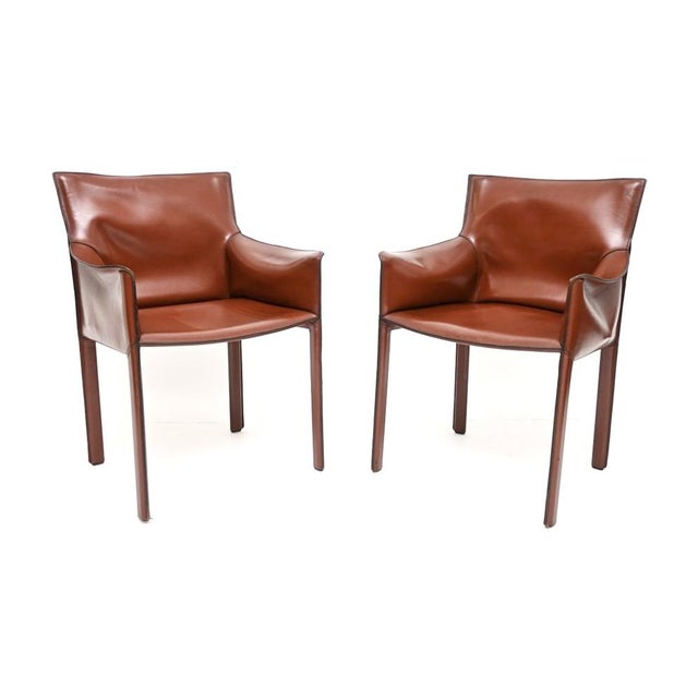 A beautiful pair of vintage Italian leather armchairs by Enrico Pellizzoni. They were made in Italy and date from around...