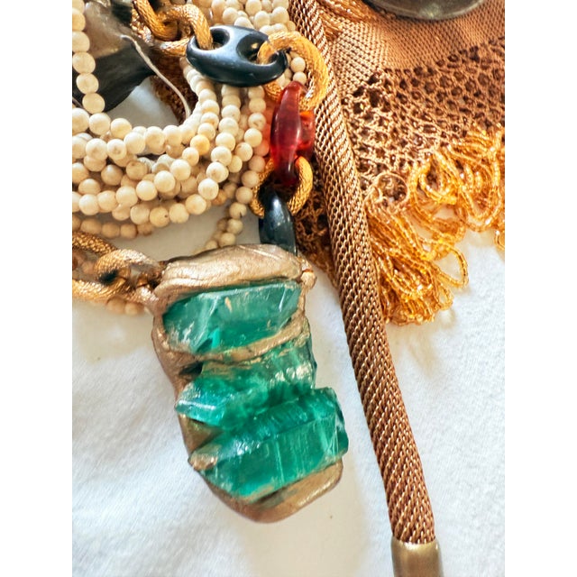 Striking artisan statement necklace featuring three rough green calcite crystal points set into a large hand sculpted...