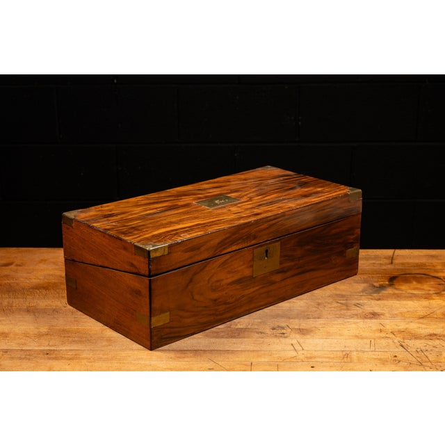 Late 19th or early 20th century wooden writing box or lap desk. This piece features richly stained walnut on the exterior...