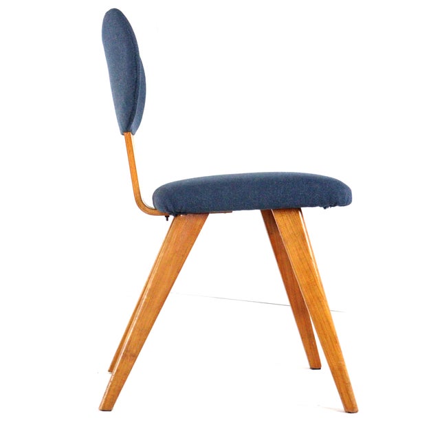 A complete set you don't often find: a Dutch dining set from the late 1950s, completely in the spirit of the Mid-Century...