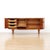 A teak credenza by Hubbinet furniture from the 1960s. Produced in rich teak, this striking cabinet beautiful scalloped...