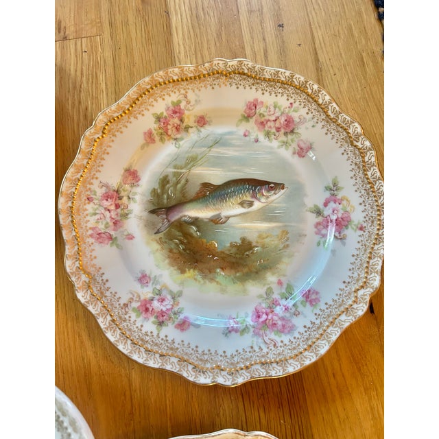 This collection is an antique porcelain fish service by O. & E.G. Royal Austria, dating to the early 20th century, circa...
