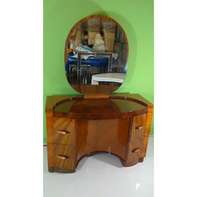 An Art Deco vanity in excellent condition and refurbished with a glossy finish polish as is usual of Deco furniture. 3...