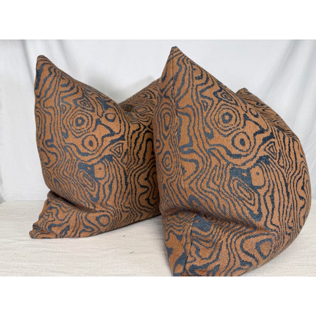Custom pair of 22" pillows covered in Lee Jofa "Atlas" in rust/navy chenille fabric. These pillows have tapered corners to...