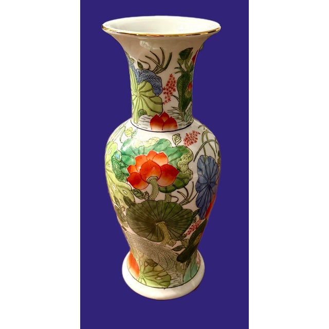 Vibrant Chinse vase with lotus motif and gilt trim. Bright colors including orange, green, blue and turquoise make this a...
