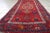 Handmade vintage Persian Hamadan rug in bright red color with large medallion. The rug is from the end of 20th century in...