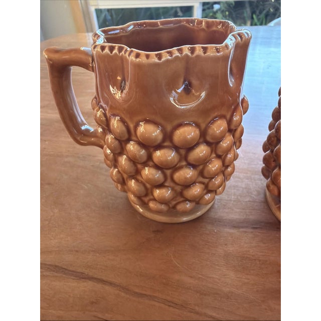 Vintage pair of INARCO ceramic mugs in a rich brown glaze with a distinctive hobnail (raised dot) texture. These mugs...