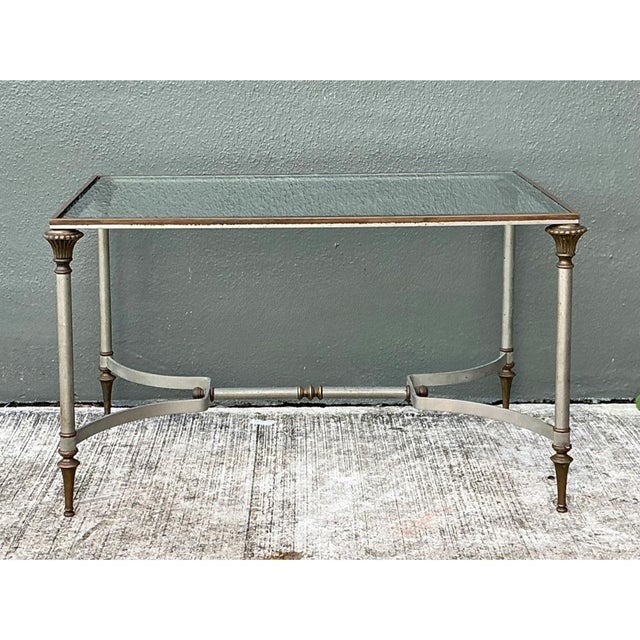 This vintage rectangular table channels the refined elegance of Maison Jansen's celebrated mid-century vocabulary, pairing...