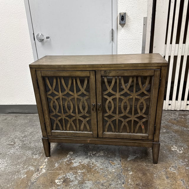 Design Plus Gallery presents a Kire Two-Door Accent Cabinet from Coast to Coast Imports. This cabinet has a rectangular...