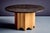 Octagonal pedestal table with a round slate top. The thick stone surface has a rough, naturally mottled texture, set on a...