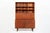 This Danish modern teak secretary bookcase cabinet was designed by Peter Løvig Nielsen and produced by Løvig Dansk Designs...