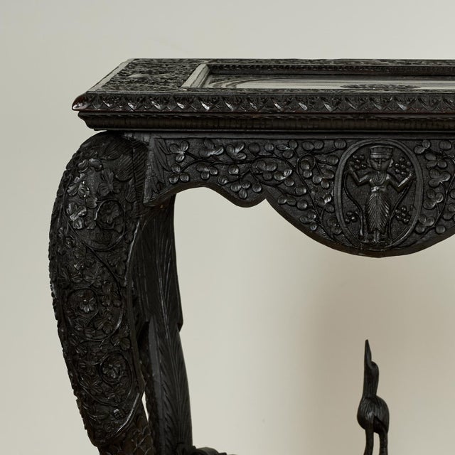 Stunning 19th century Anglo Indian table handcrafted in rosewood featuring a square top with a carved center medallion...