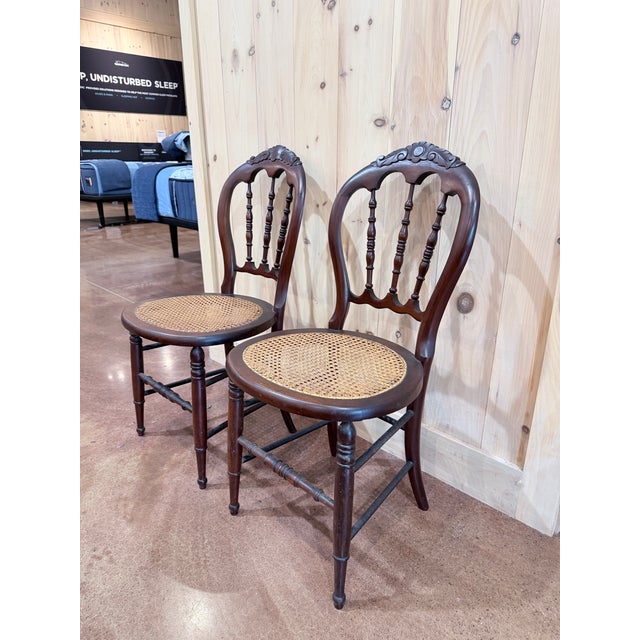 beautifully proportioned pair of vintage Victorian-style balloon back side chairs, crafted in mahogany with graceful...