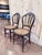 beautifully proportioned pair of vintage Victorian-style balloon back side chairs, crafted in mahogany with graceful...
