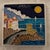 Small Amalfi coast plate depicting coastal scene with beautiful blue seas, cliffs, and mountains. Marked “Reazioni Luciano...
