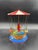 Vintage tin carousel toy with ships, branded Dumbo and made in West Germany in the 1950s and 1960s. It is made of...