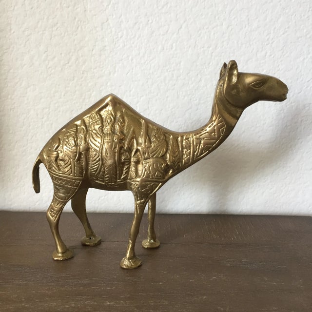 A vintage brass camel with Three Wise Men Nativity scene on both sides. Measurements 7.25" x 1.75" x 6" tall Net weight 1...
