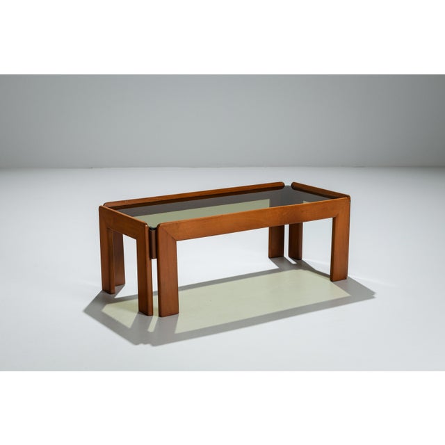 This vintage coffee table embodies the quiet sophistication and architectural clarity associated with Italian modernist...