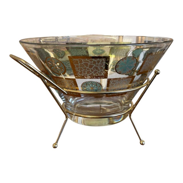 Vintage Mid-Century Modern serving bowl featuring a clear, flared glass vessel decorated with repeating geometric square...