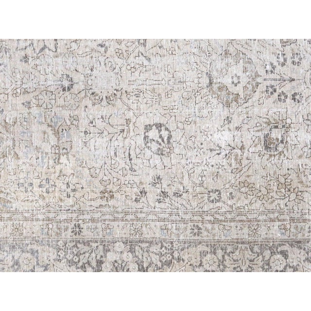 This Semi Antique Persian Tabriz Rug is expertly handwoven in the Tabriz region of Northern Iran. It has been distressed...