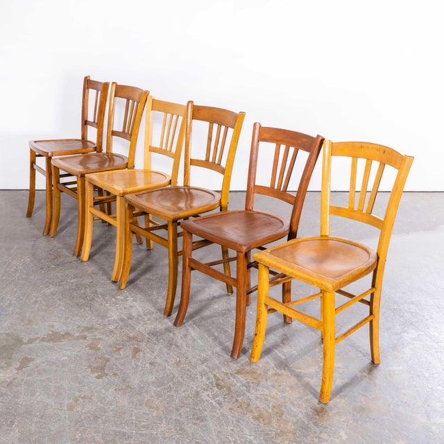 1950’s Standard Blonde Farmhouse French Mixed Dining Chairs. Set Of Four. This listing is for what we call a ‘standard...