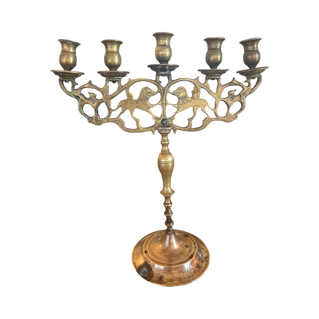 A breathtaking antique solid brass five-light Shabbat candelabra — an exceptional example of Eastern European Judaica...