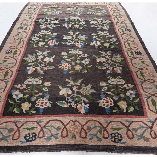 This charming antique Bessarabian rug embodies the rich folkloric spirit and decorative finesse of Eastern European...