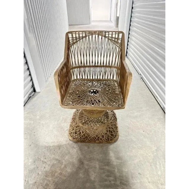 This Mid-Century Modernism dining set includes a table and four chairs, all designed by Russell Woodard. The set has a...