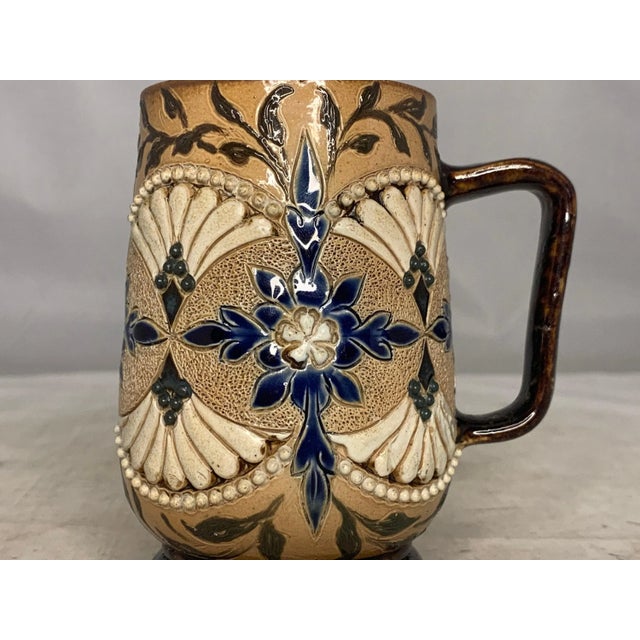 Doulton Lambeth Salt Glazed Stoneware Mug for your consideration. The mug measures approx. 4 inches tall and approx. 3 1/2...