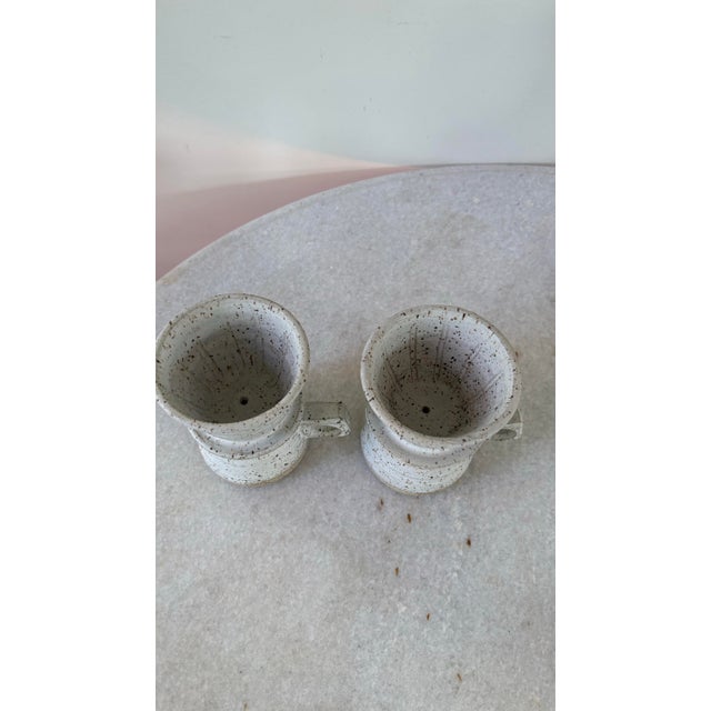 Wonderful pair of cape cod pottery coffee cups with dip cup.