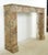 This French Regency style mantel is carved out of burgundy and tan marble with striking white and gray veining. This...