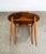 Iconic round end table in walnut by Heritage Henredon. This item has been recently refinished. The table is marked beneath.