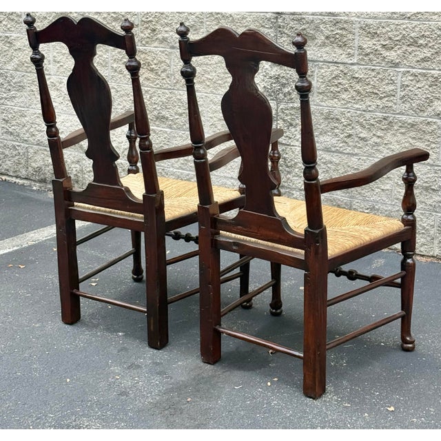 Gorgeous pair of 18th century inspired Queen Anne chairs. Features a splat back, woven rush seat and turned legs and...