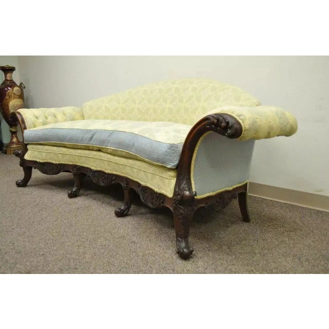 Antique 19th C. Georgian Style Rolled Arm Carved Mahogany Curved Frame Sofa. Item features a whimsically curved frame,...