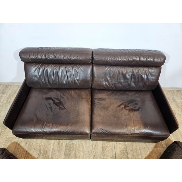De Sede DS76 leather sofa bed from the 1970s. Full-grain leather upholstery exudes luxury and durability, showcasing the...