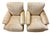 A luxurious pair of generously proportioned lounge chairs upholstered in a softly textured champagne-gold chenille fabric...