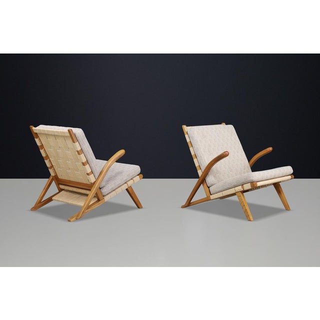 Pair of Sculptural Oak Lounge Chairs, Europe, 1960s An exceptional pair of sculptural lounge chairs produced in Europe...