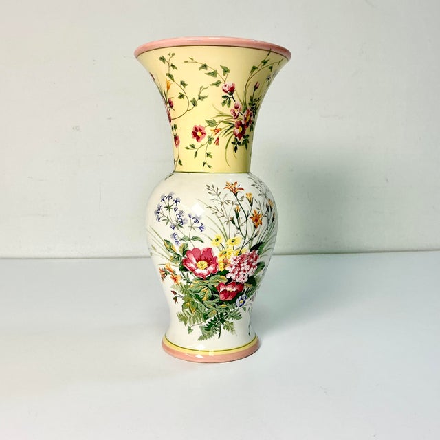 A lovely flora transferware ceramic vase from Laura Ashley. The beautiful flora botanicals are in cerise pink, cornflower...