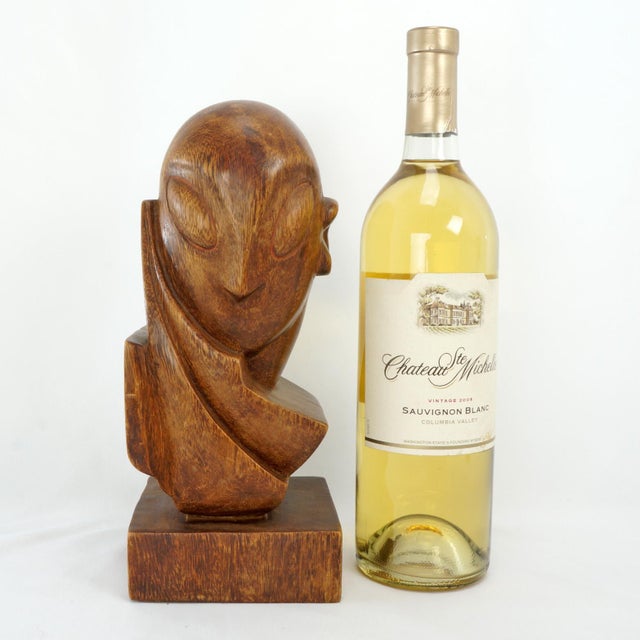A fun, artistic, large bookend that depicts a modernist bust with a hand in a resting position. The figure features...