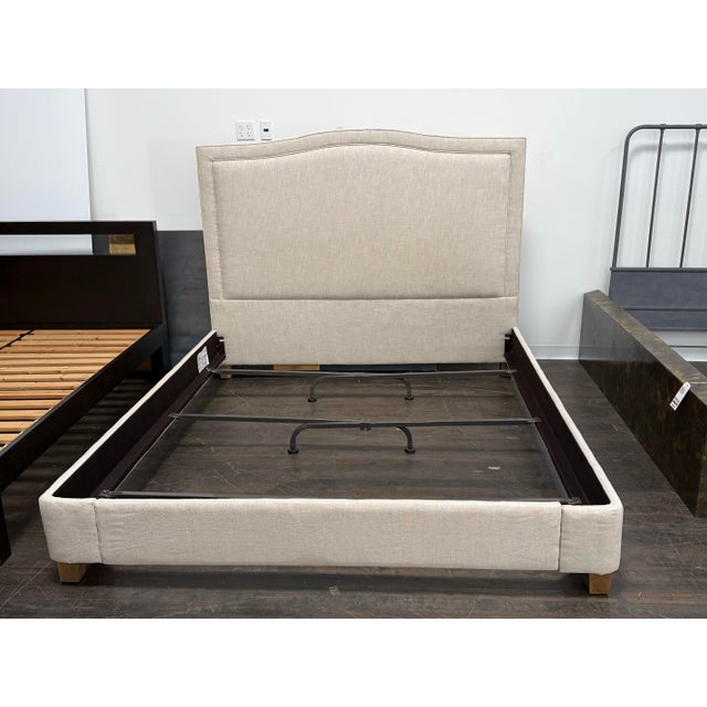 Design Plus Gallery presents a California King Lathem Bed Frame from Restoration Hardware. Upholstered in a neutral...