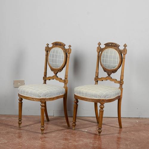 This refined pair of chairs dates back to the late 19th century, an era characterized by classic elegance and meticulous...