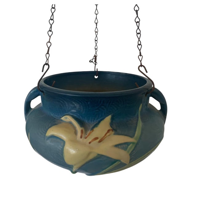 From the Late Period of Roseville Art Pottery, this is their Hanging Planter with the Zephyr Lily Pattern, circa 1946. On...