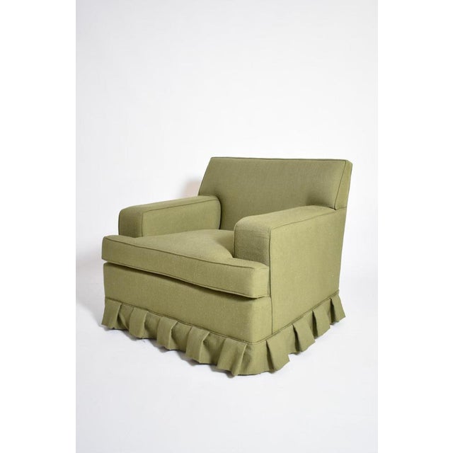 Pair of green fabric armchairs fringe, 1960s. Pair of green fabric armchairs with a folded fabric fringe in the down part....