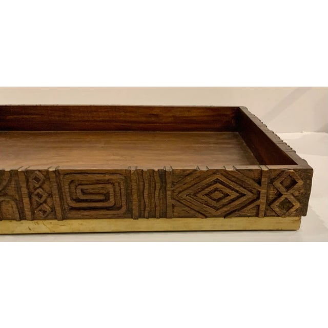 Stylish Mid-Century Modern Style Carved Mango Wood Oti Tray, gold finished base, showroom floor sample
