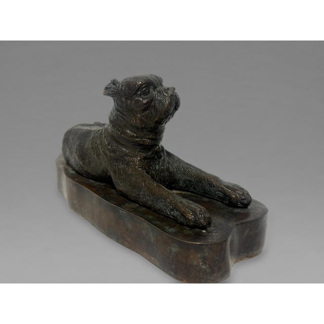 European Patinated Bronze Recumbent Pug, 19th Century A sensitively modeled figure of a reclining pug, cast in bronze,...