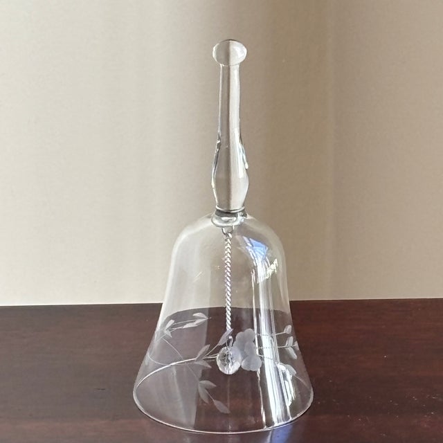 An elegant vintage crystal dinner bell featuring a beautifully balanced silhouette with a tall, sculptural blown-glass...